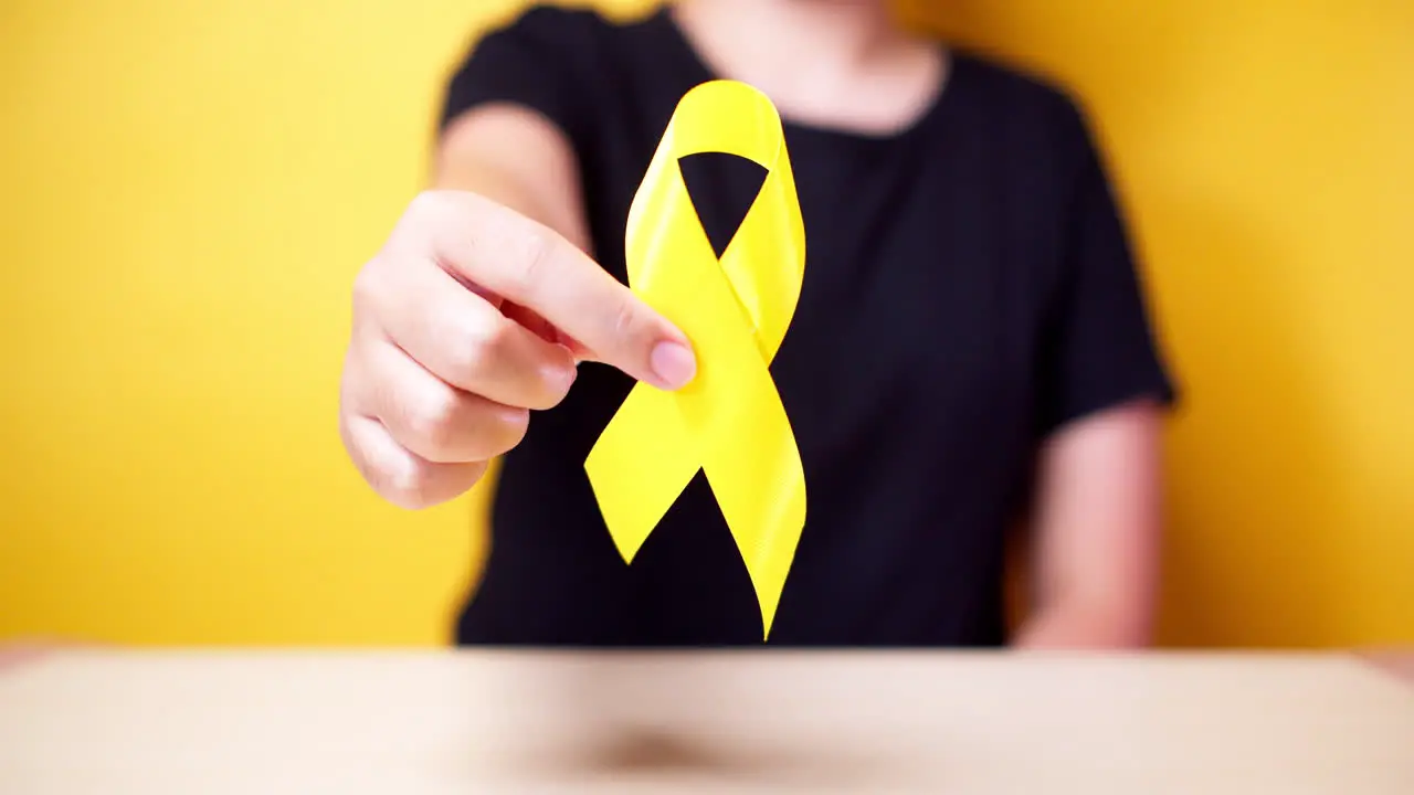 Suicide prevention day Sarcoma bone bladder and Childhood cancer Awareness month Yellow Ribbon for supporting people living and illness