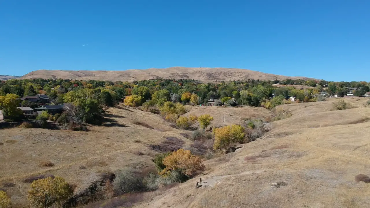 A drone flight over a ravine on a fall day