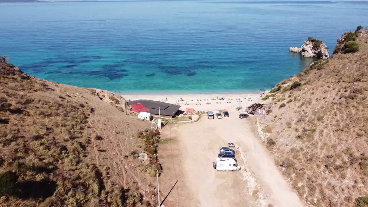 Entrance to Mirror Beach and Clear Blue Ionian Sea in Ksamil Albania Aerial