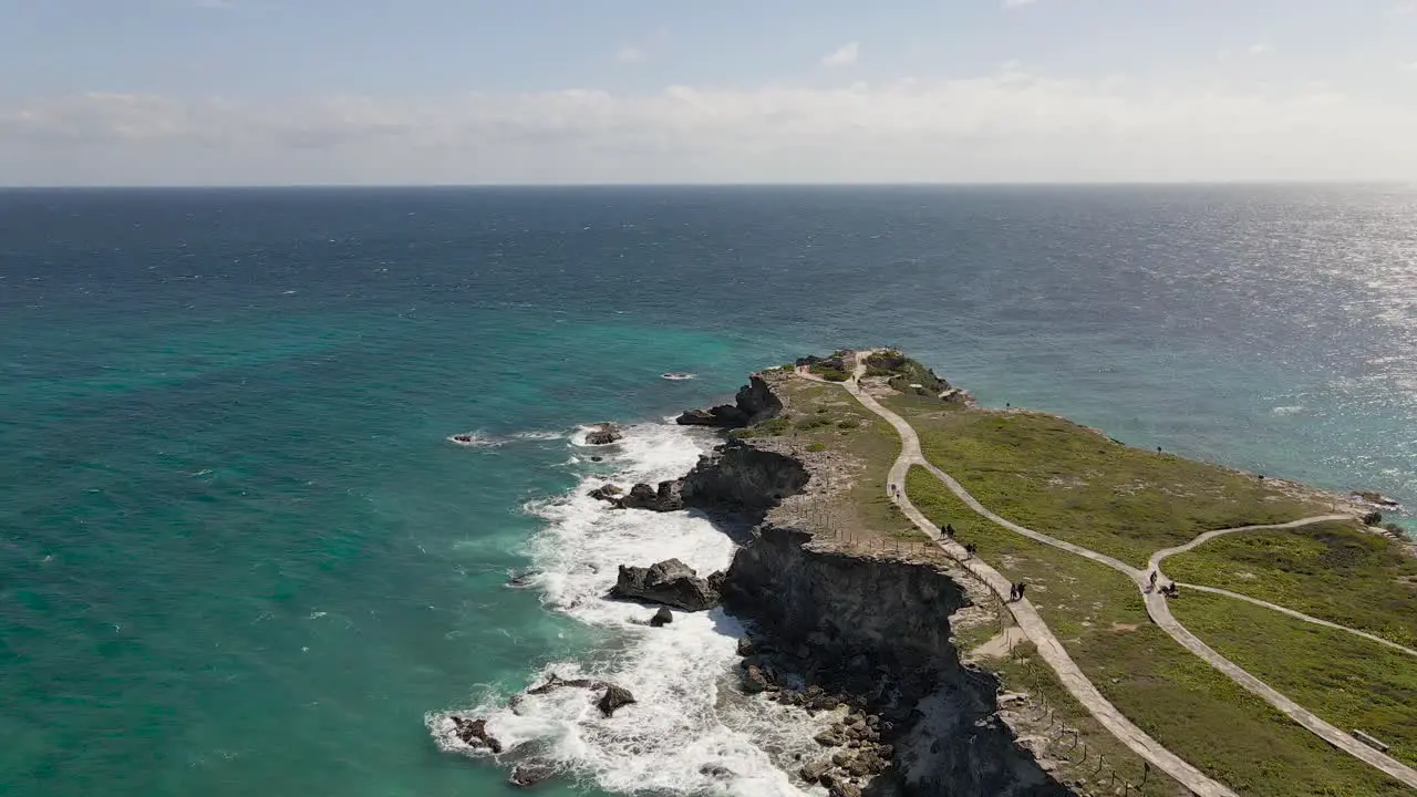 Aerial of rocky cliffs on a beautiful blue sea Isla Mujeres Mexico