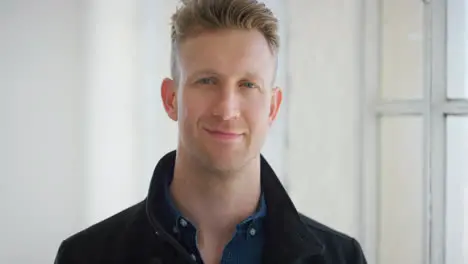 Face portrait of a handsome business man smiling