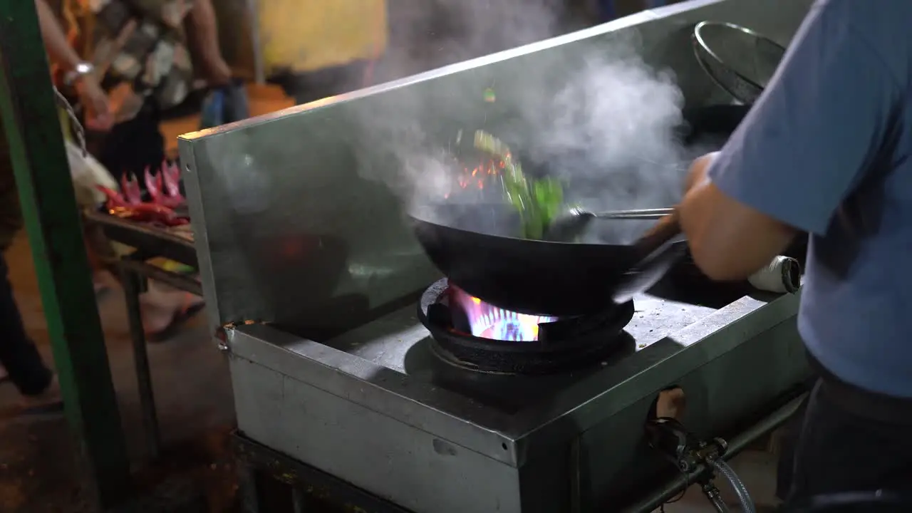 Cook preparing food in Kota Kinabalu local market