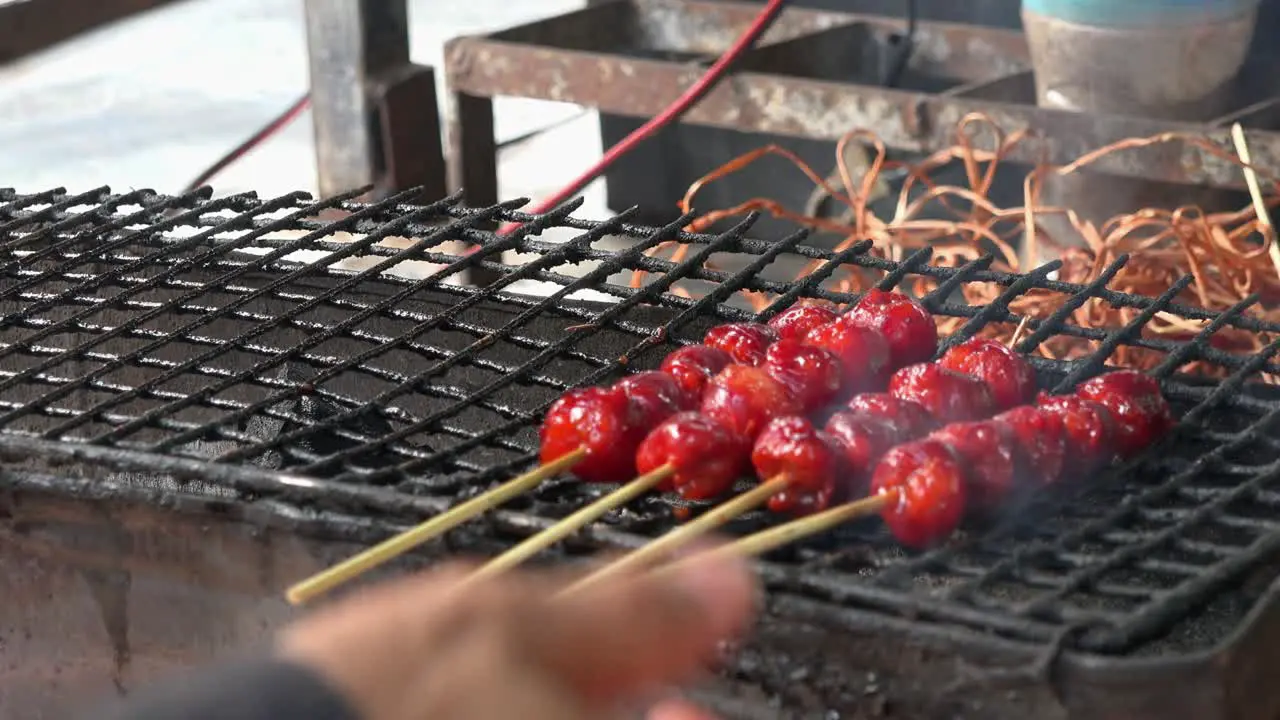 Street Food Meatball Skewers Being Grilled on the Barbecue