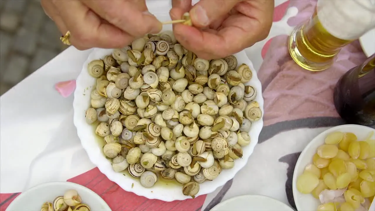 Eating Cooked Snails Escargot From Plate delicious Portuguese food