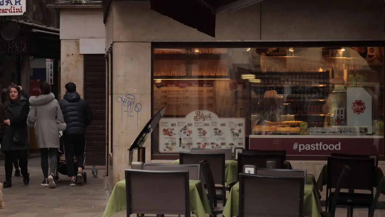 People passing by a fast food restaurant in Venice