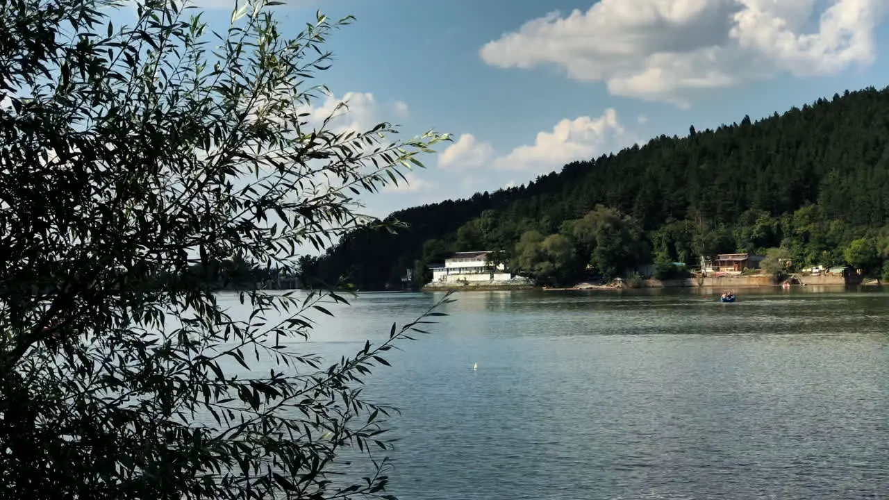 Reveal shot of the Pancharevo Lake Bulgaria with a smooth camera pan from left to right