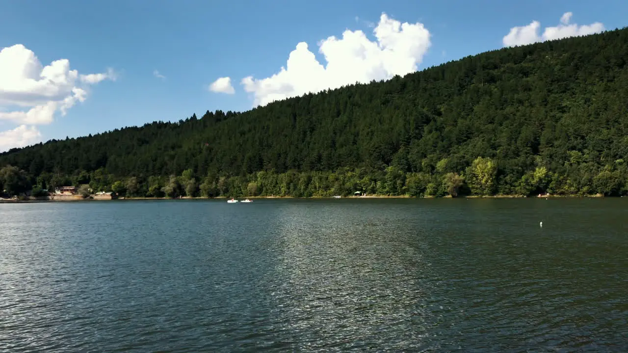 Clip of the Pancharevo Lake with some sailboats sailing during a sunny day