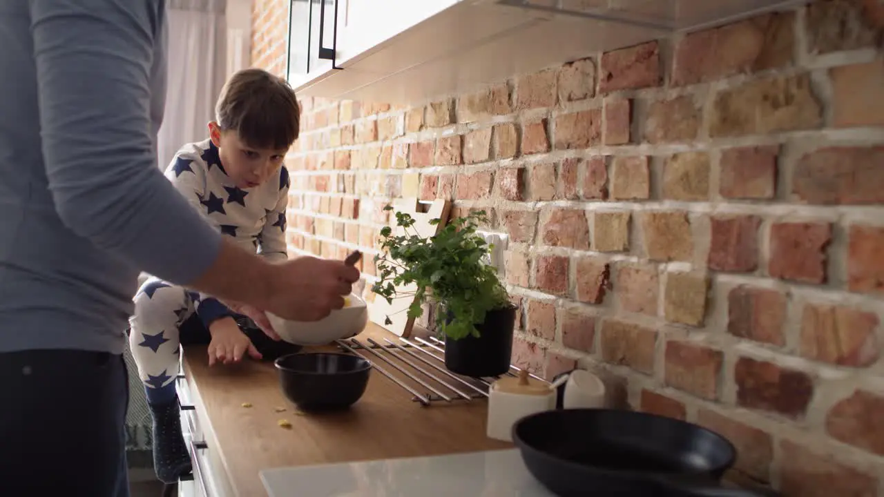 Close up video of father preparing breakfast cereal