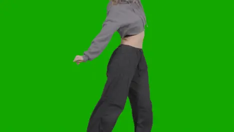 Close Up Studio Shot Of Young Woman Having Fun Dancing Against Green Screen 1