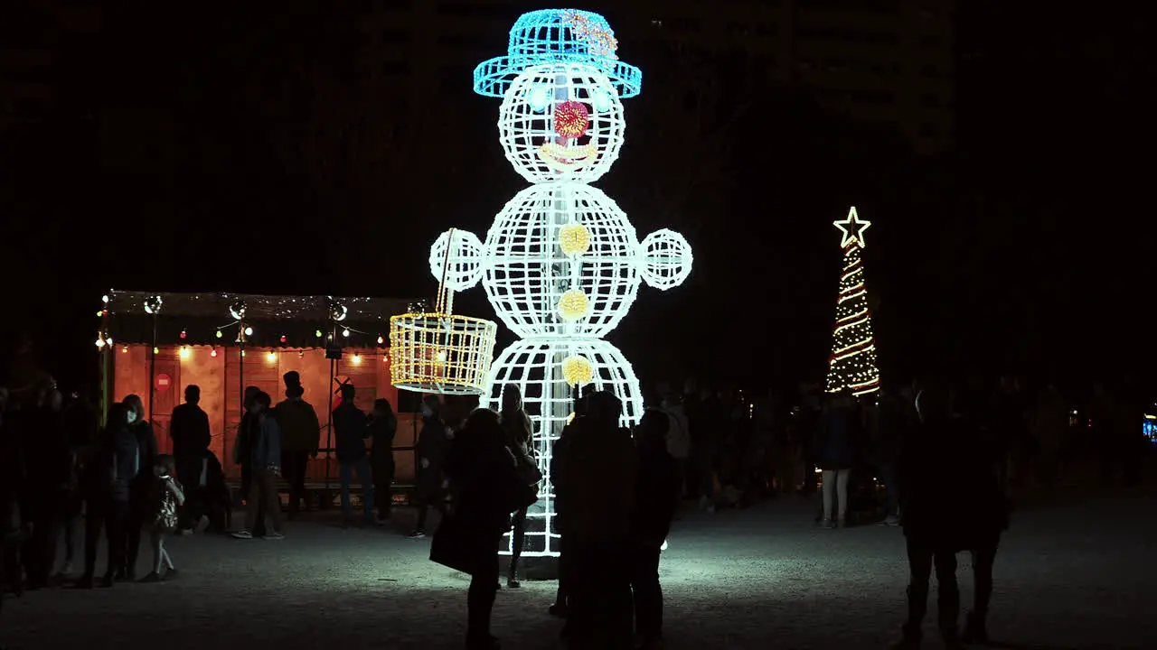 Led snowman christmas illuminations dark winter evening