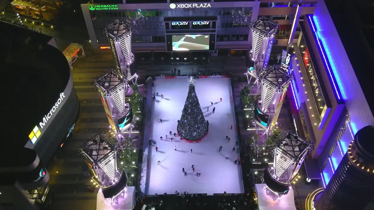 Ice Skating Ring | Downtown Los Angeles | Xbox Plaza | LA Live | Christmas Tree | Night time | Overhead Pass By Shot