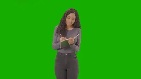 Portrait Of Female Doctor In White Lab Coat With Stethoscope Against Green Screen 1