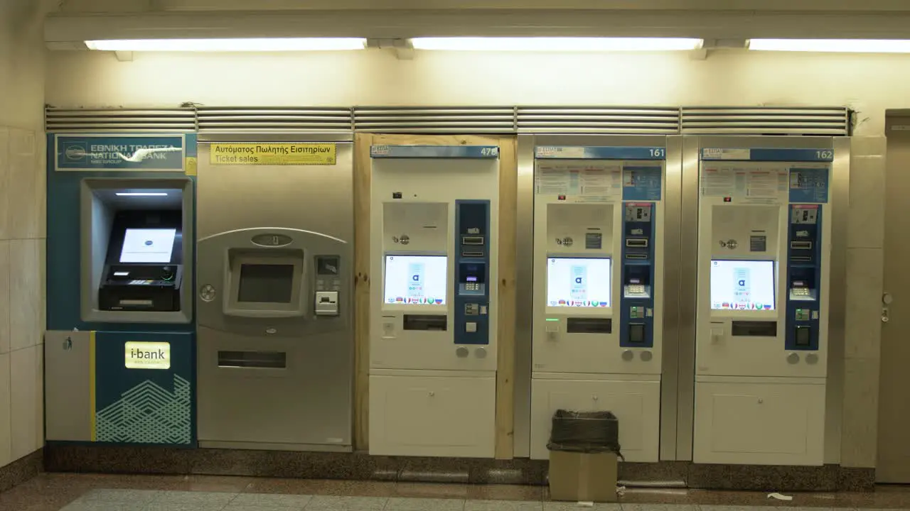 A girl walks past ticket machines in the Athens metro