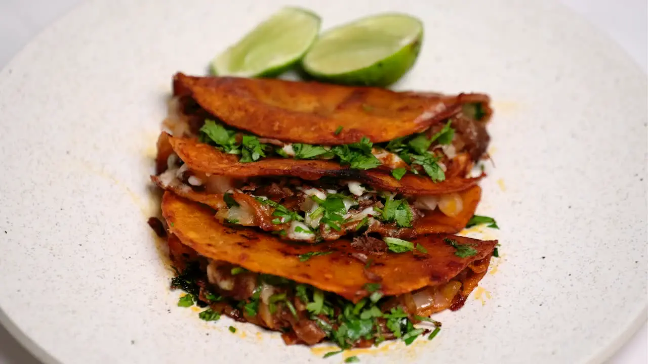 Quesabirria tacos on plate rotating on lazy susan