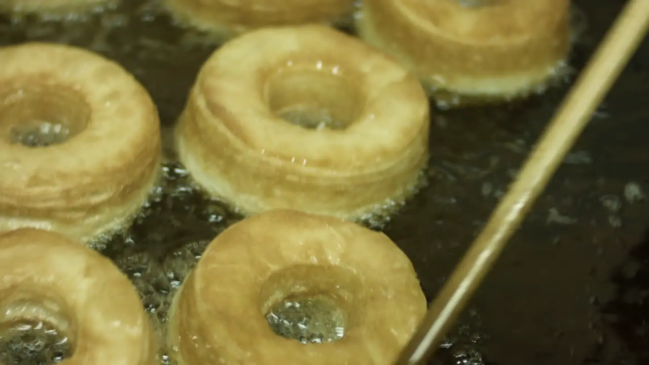 Frying Some Hot And Delicious Donuts