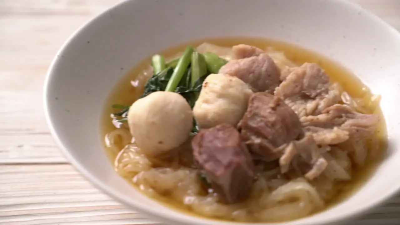 Braised pork noodles bowl on table