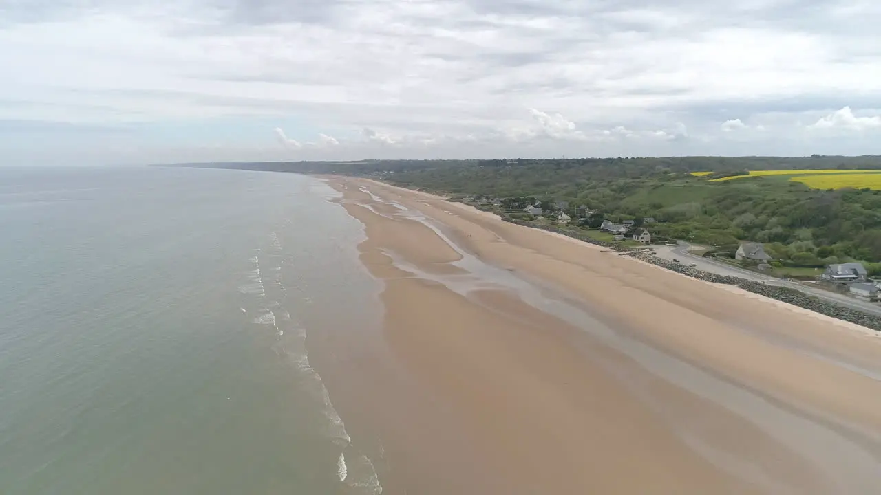 Establishing aerial drone view of isolated Omaha Beach near Colleville sur Mer Normandy France