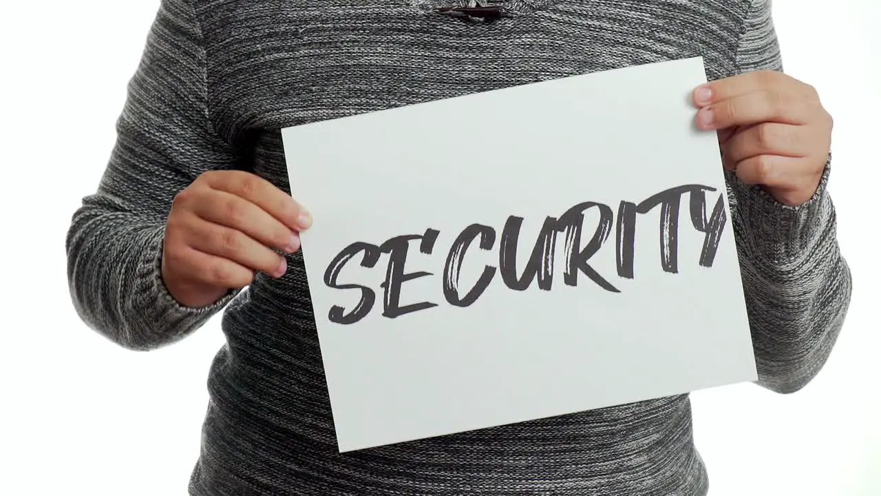 A concerned person holding a sign with a safety message