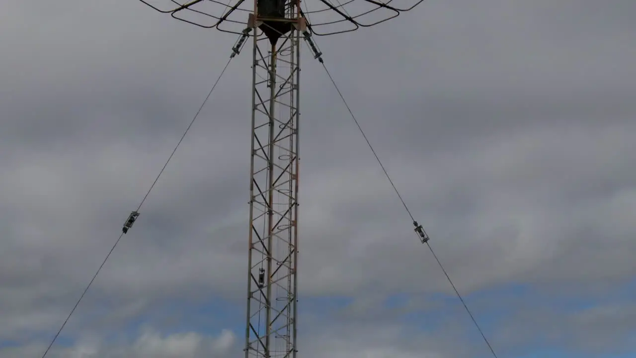 Drone rises above huge tall communications tower in Perth Western Australia