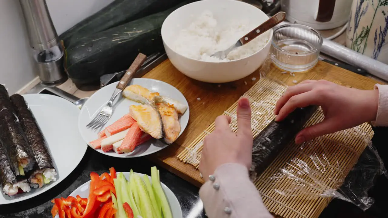 Lady Rolling Green Sushi On Wooden Mat Homemade Preparation