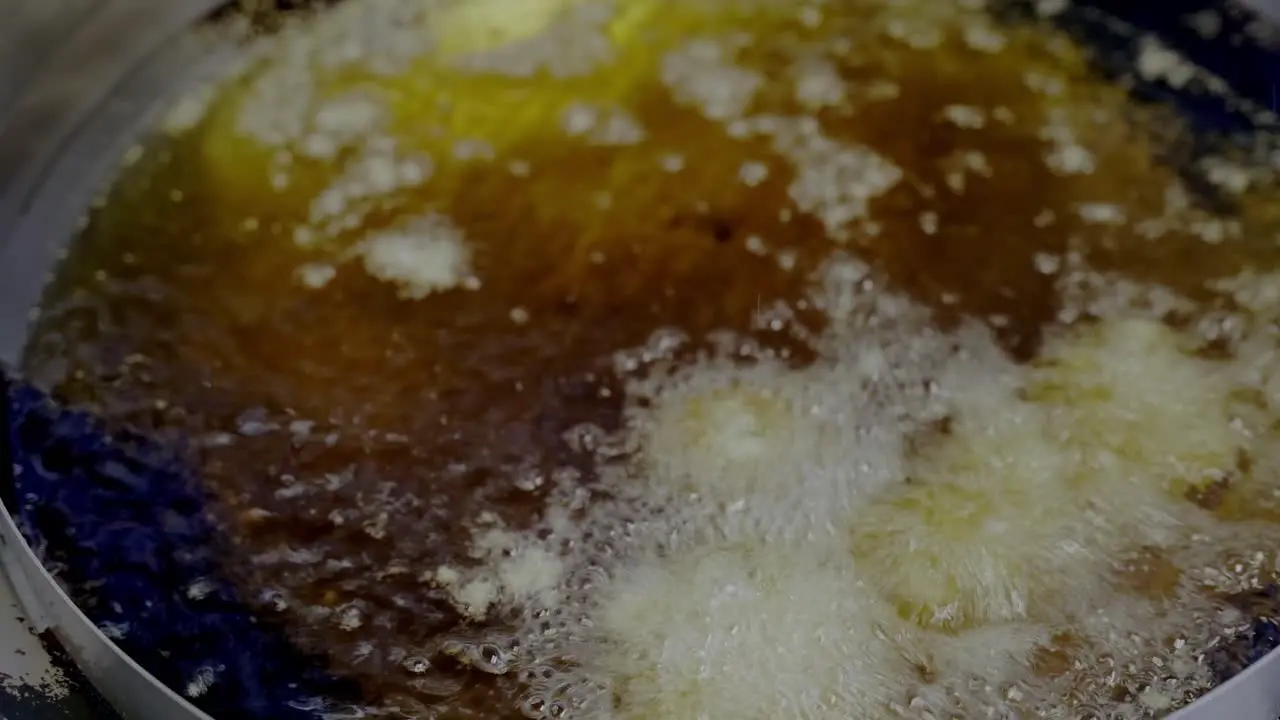 Macro Shot Of Delicious Falafel Fried In Oil Making Hot Bubbles