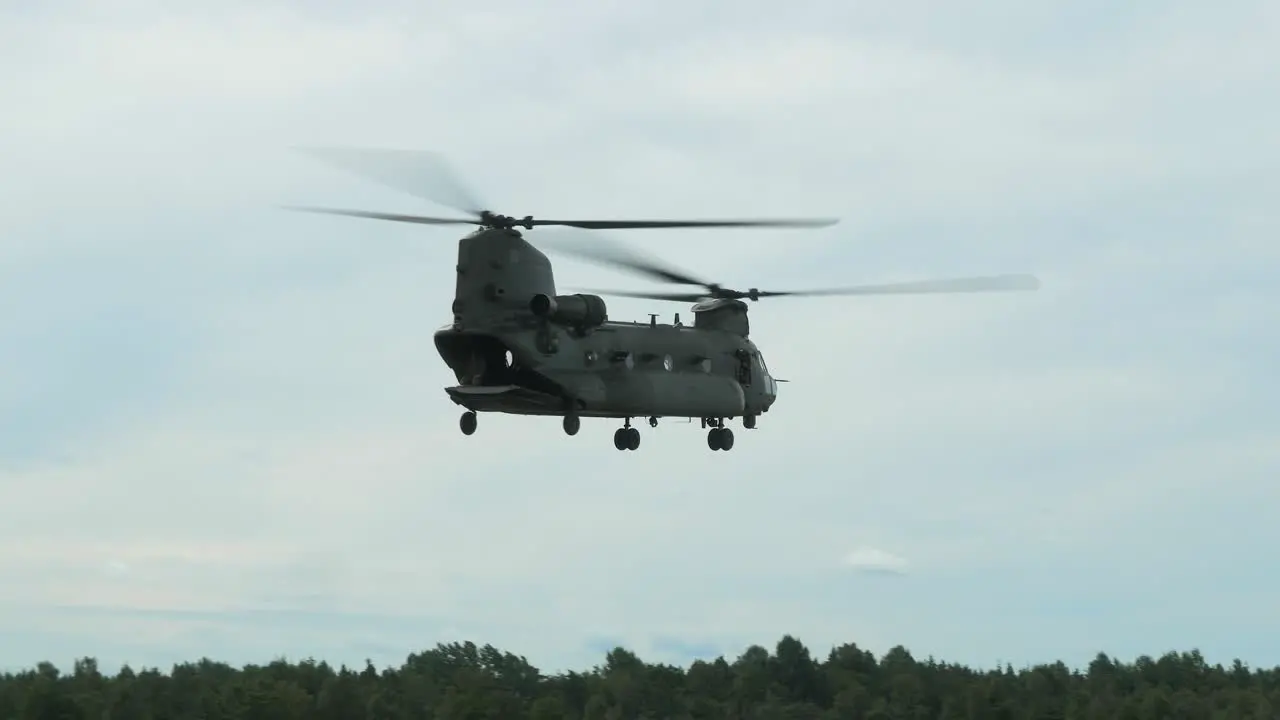 Chinook CH47 helicopter flying slowly sideways with slow rotation at air show