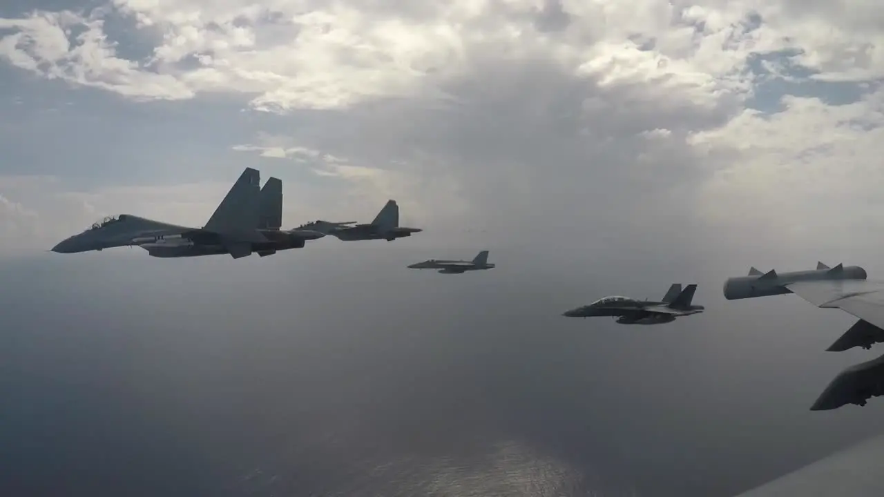 Aircraft From Carrier Air Wing 11 And Royal Malaysian Air Force Fly Above Theodore Roosevelt Carrier Strike Group