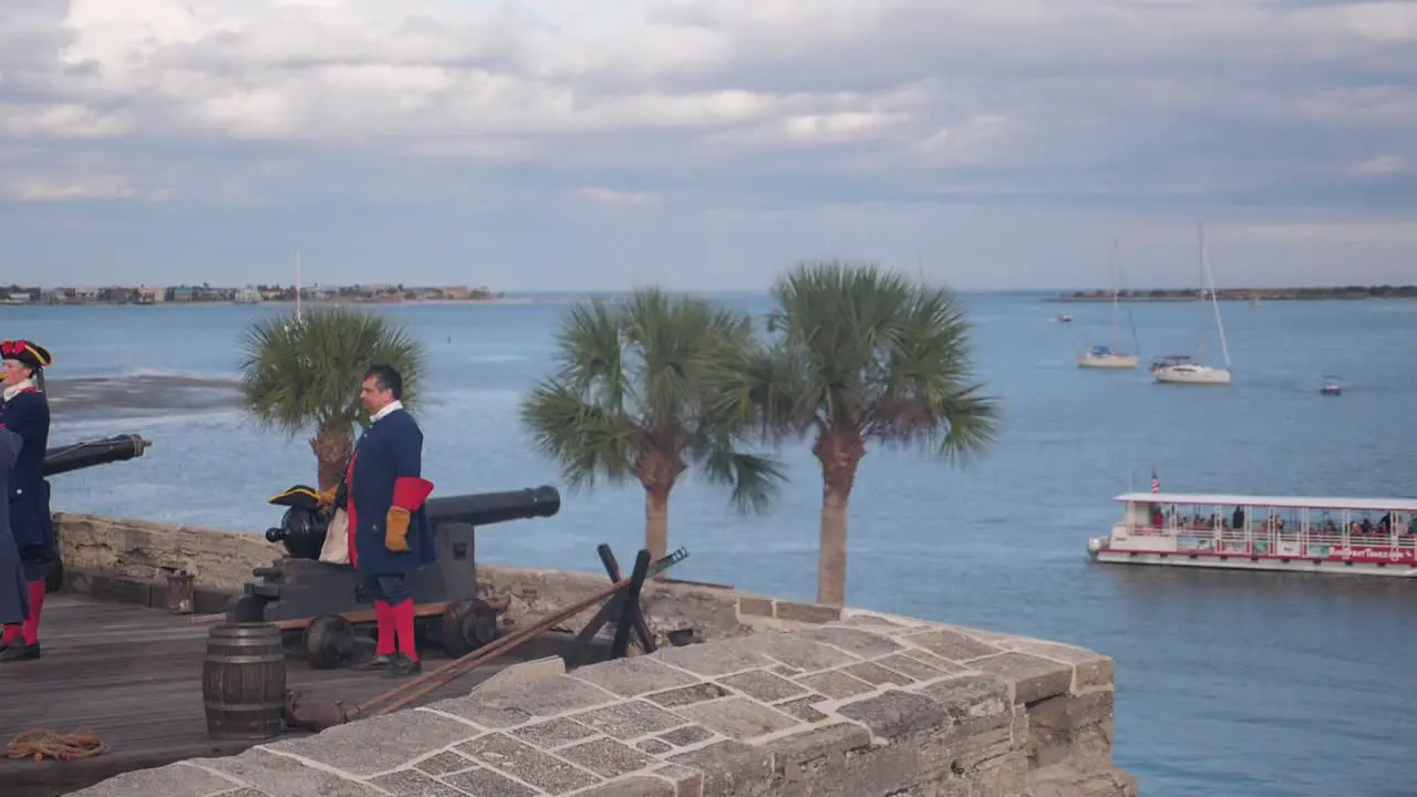 War re-enactment soldiers fire a cannon into the water