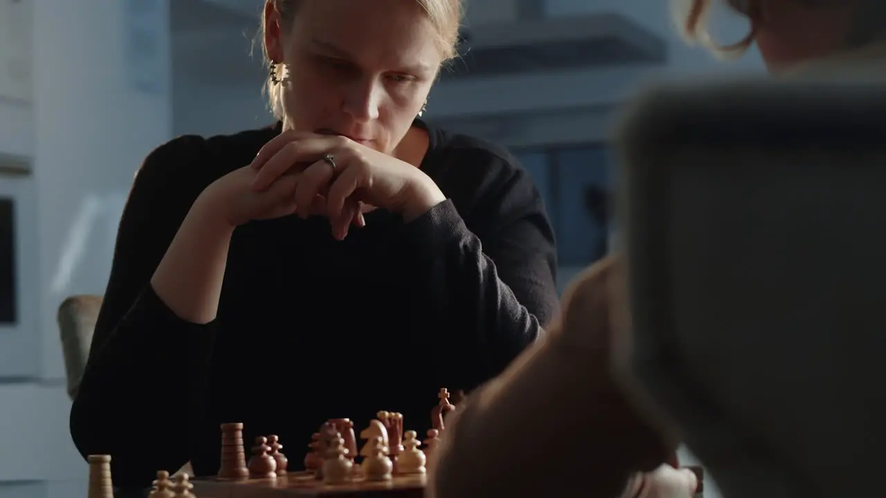 Mom and Son Face Off in a Friendly Game of Chess