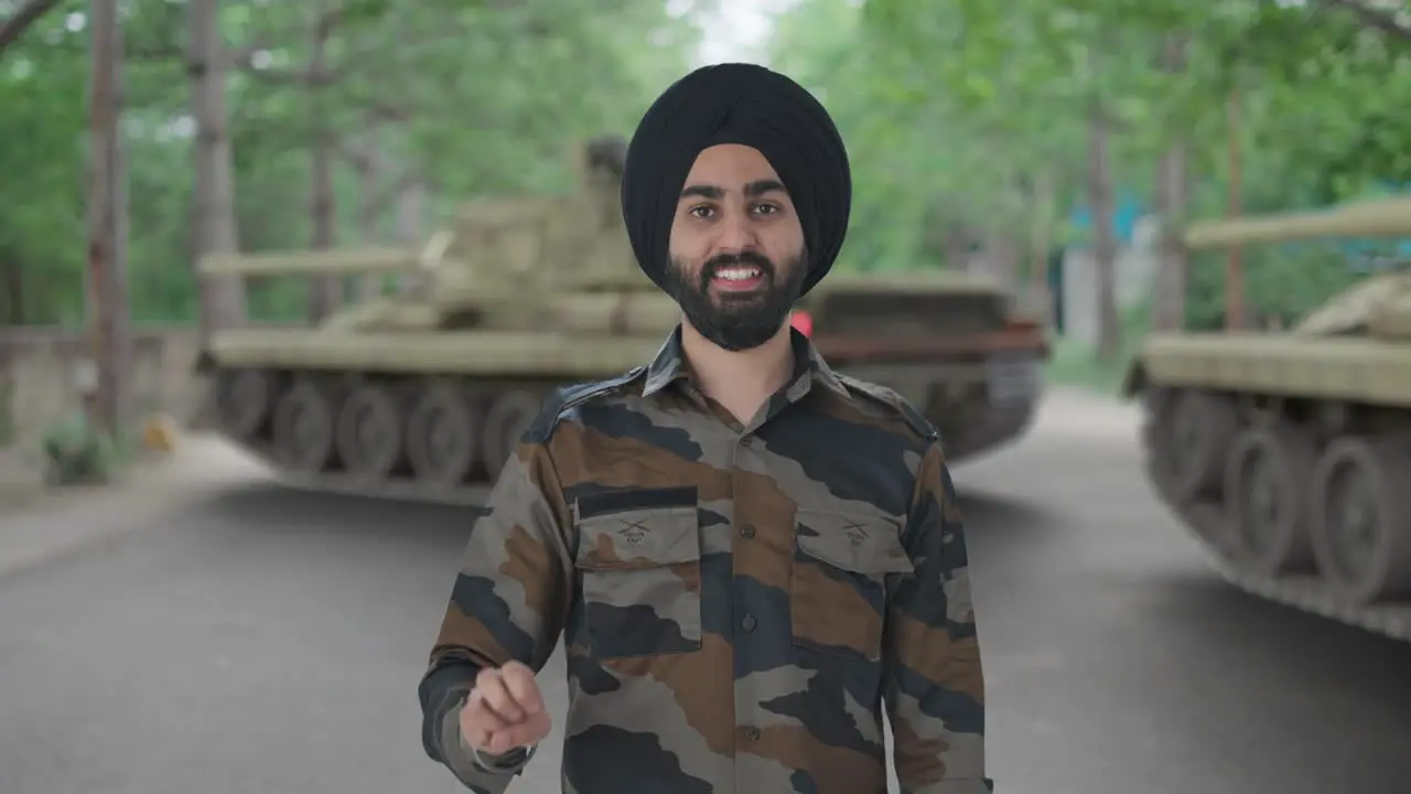 Happy Sikh Indian Army man showing victory sign