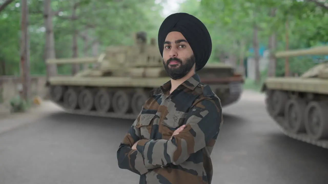 Portrait of Confident Sikh Indian Army man standing crossed hands