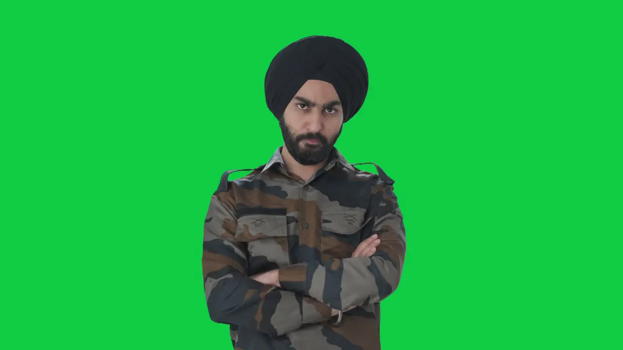 Angry Sikh Indian Army man looking at someone Green screen