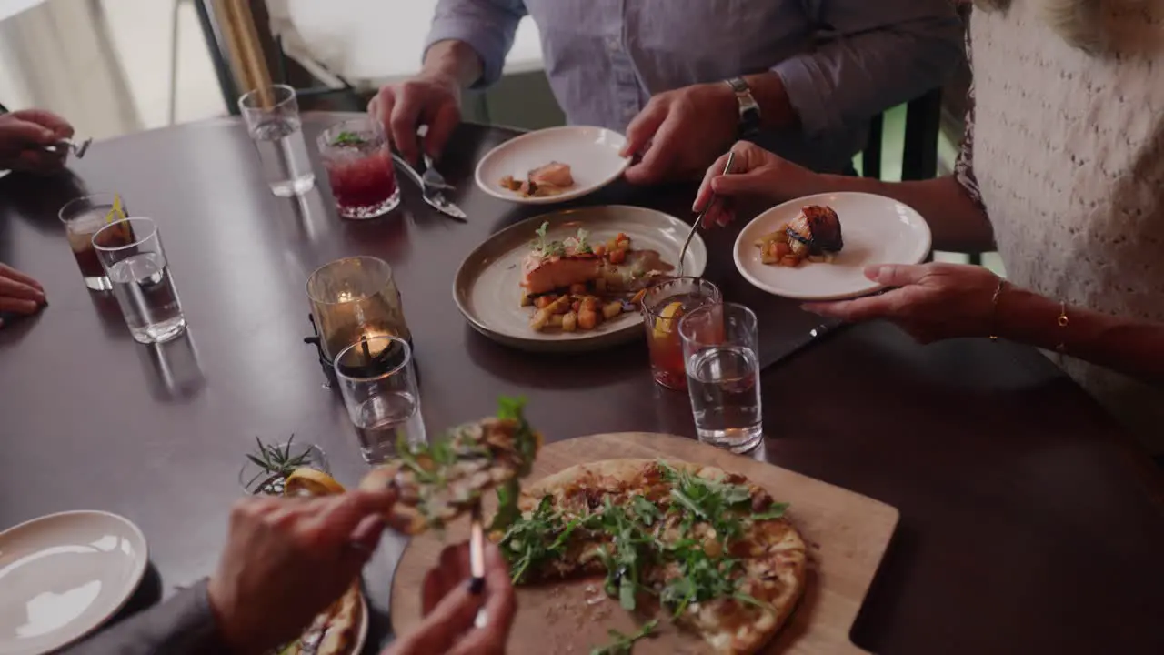 A Group of People at a Restaurant Sharing Food