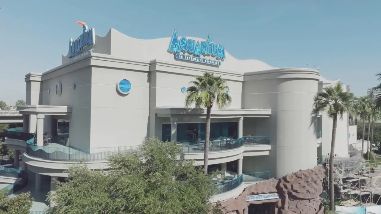 An aerial establishing shot of The Downtown Aquarium under blue skies in downtown Houston Texas