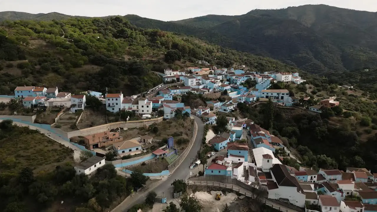 Blue color township of Juzcar also called smurf village in Spain aerial view