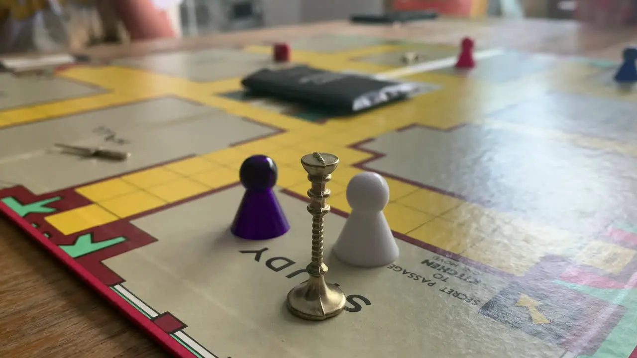 Family playing board game cludo clue close up candlestick