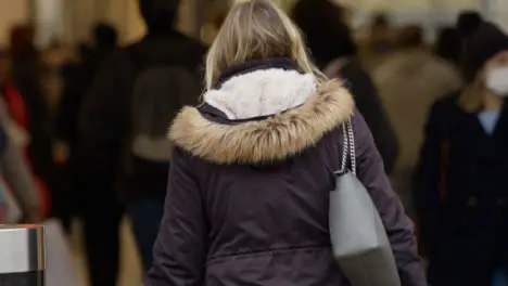 Long Shot of People Walking Into Shopping Centre Entrance In Oxford England