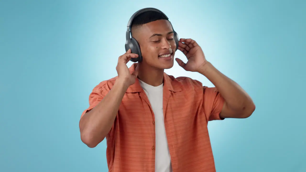 Headphones dancing and young man in a studio