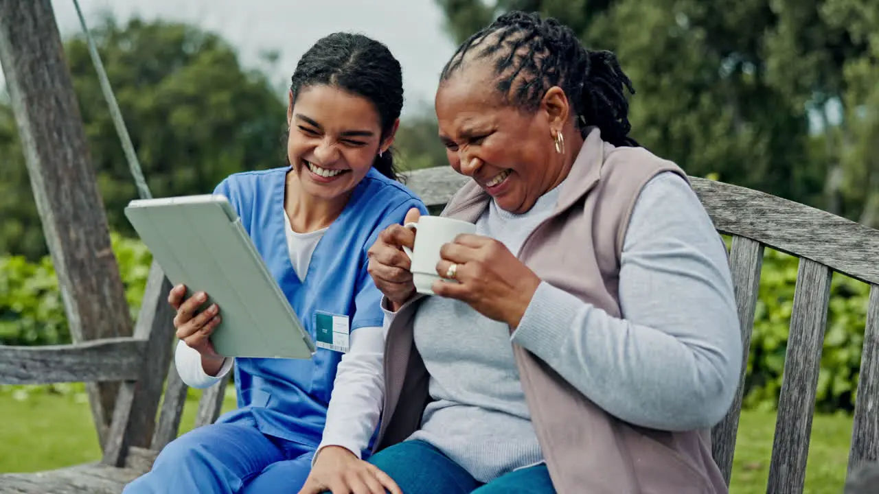 Happy woman nurse and patient on tablet