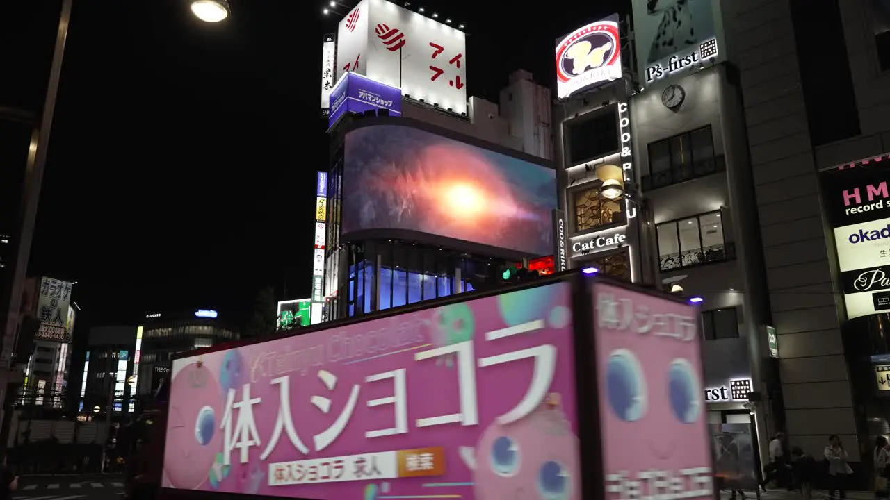 A night shot of a 3D billboard above the east exit at Shinjuku station in Japan