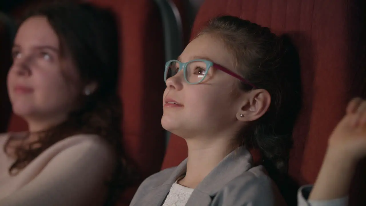 Girl smiling in the cinema