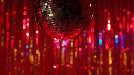 Close Up Of Revolving Mirrorball In Night Club Or Disco With Flashing Strobe Lighting And Sparkling Lights In Background 2