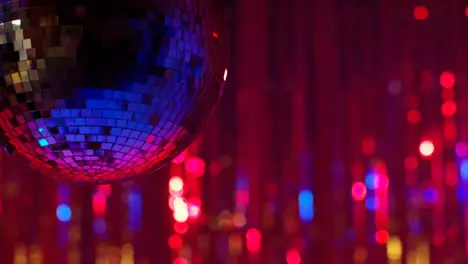 Close Up Of Revolving Mirrorball In Night Club Or Disco With Flashing Strobe Lighting And Sparkling Lights In Background 1