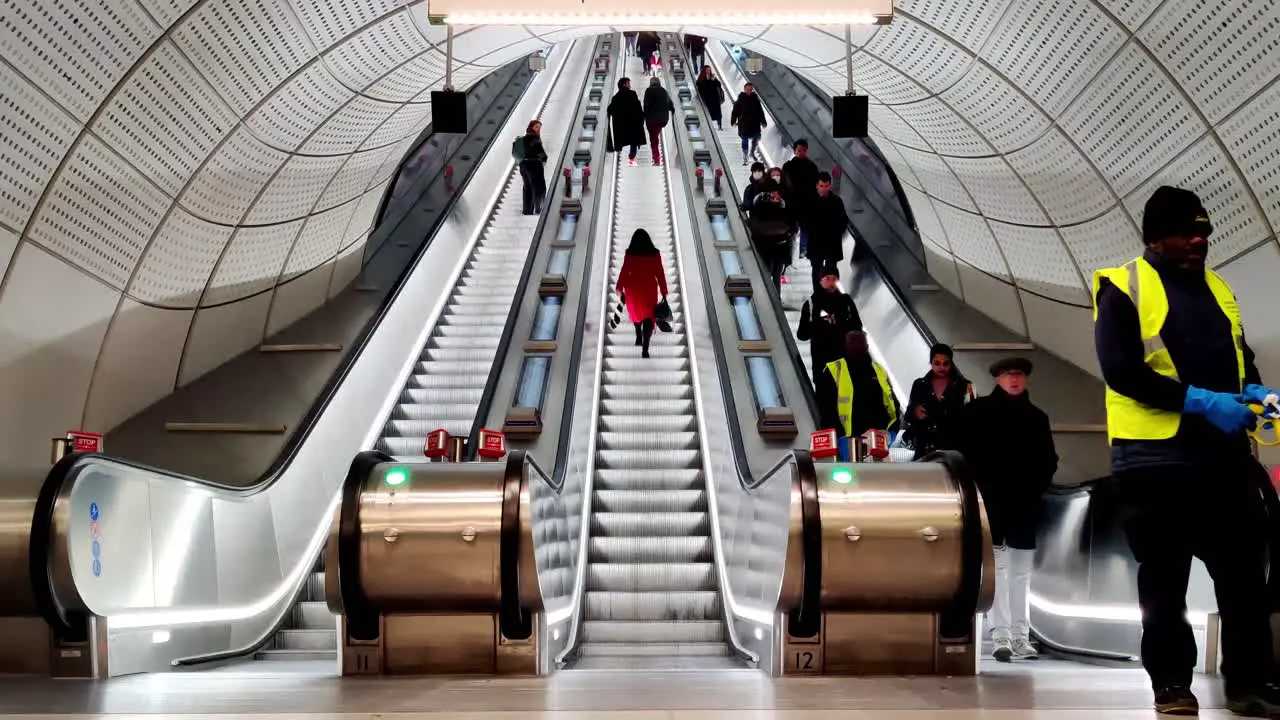 Public commuters using Bond street London underground subway escalator at Hanover Street