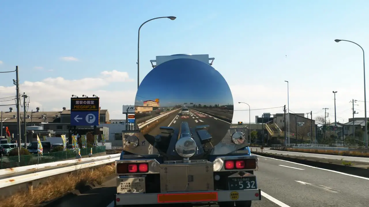 POV Following Behind Shiny Reflective Tanker On Road In Shizuoka