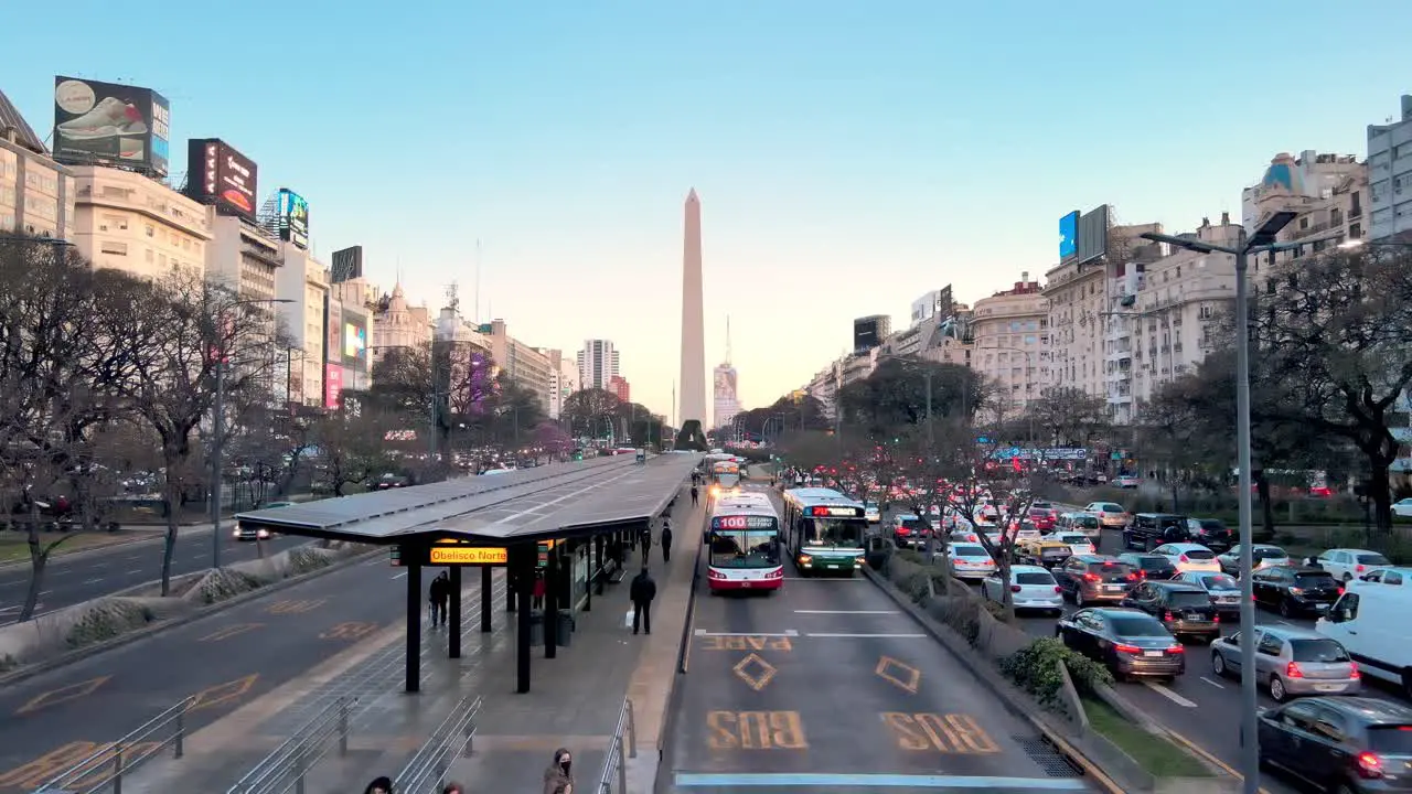 Buses pass through the bus lane along July 9 Avenue during rush hour traffic