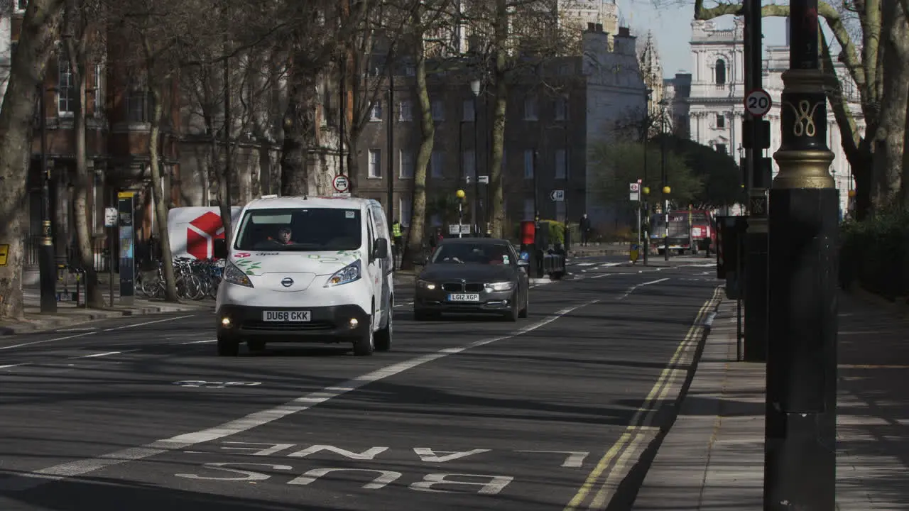 Delivery Vans Driving Along Millbank Road In London