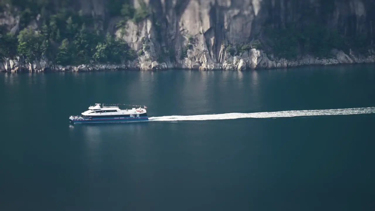 The passenger ferry crossing Lysefjord Slow-motion pan-follow