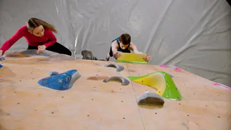 Teenagers bouldering in a gym