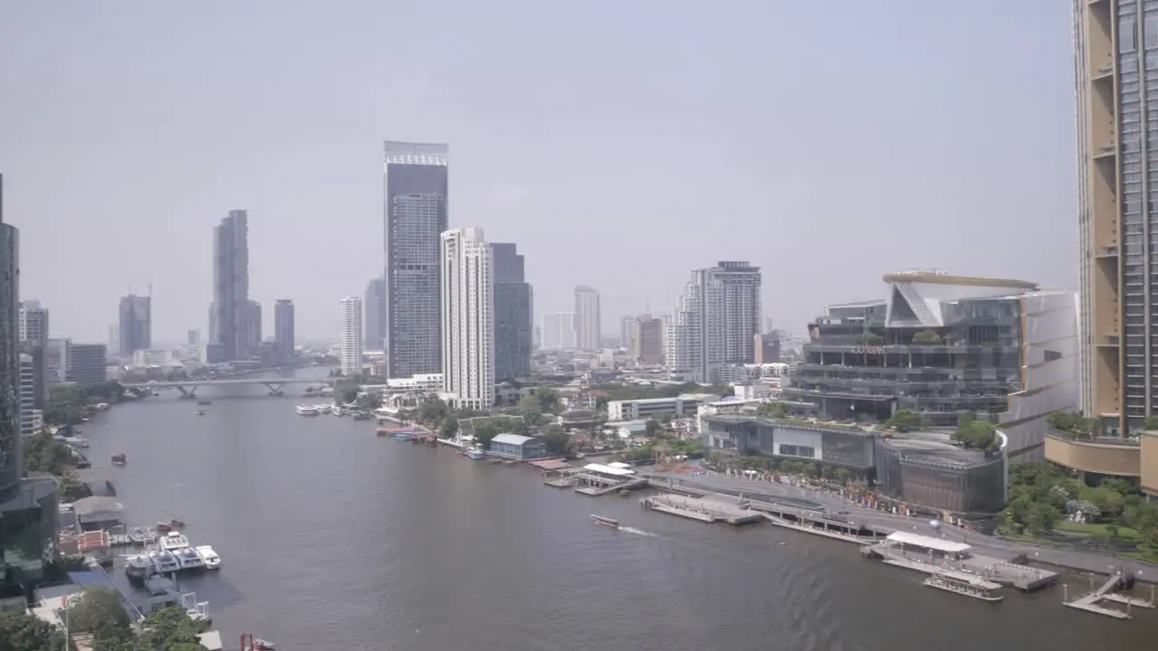 panning view of icon siam department store near Chaophraya River in the city of bangkok